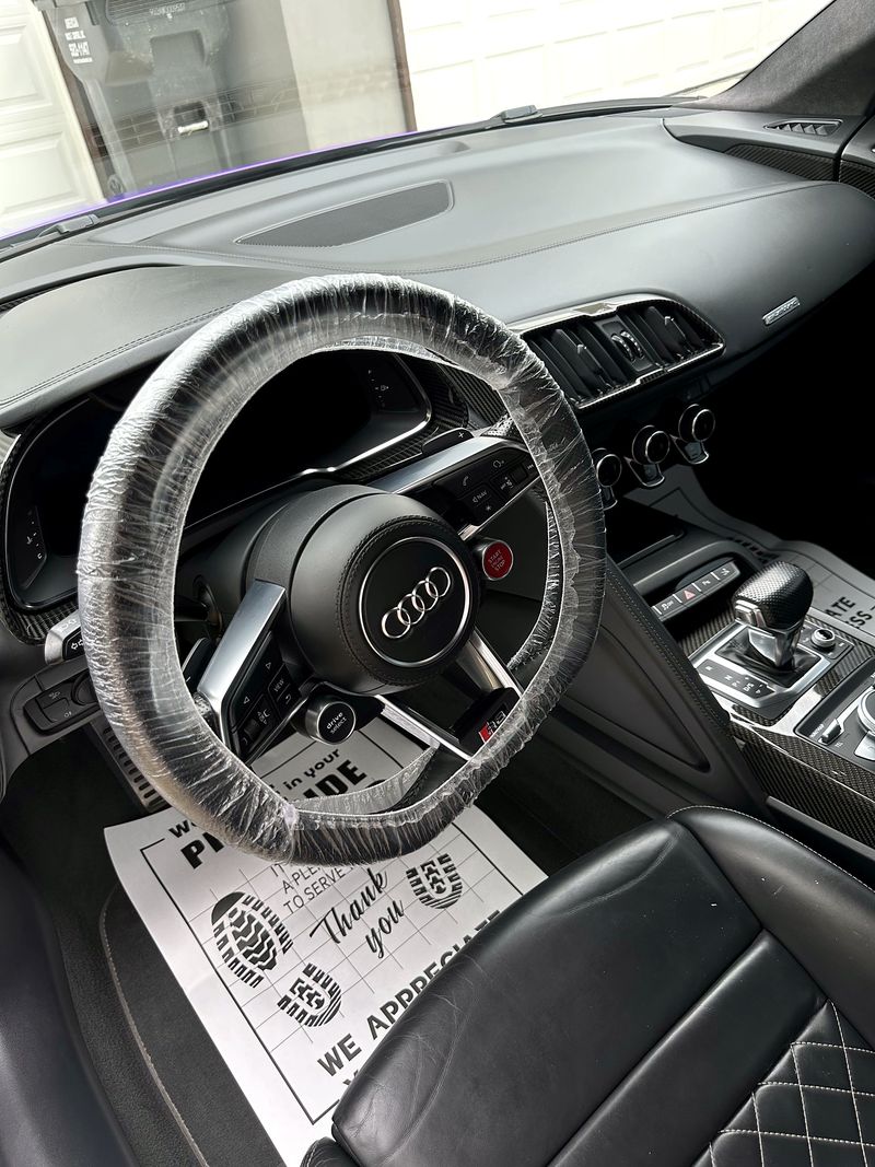 Audi R8 interior with protective covers after detailing