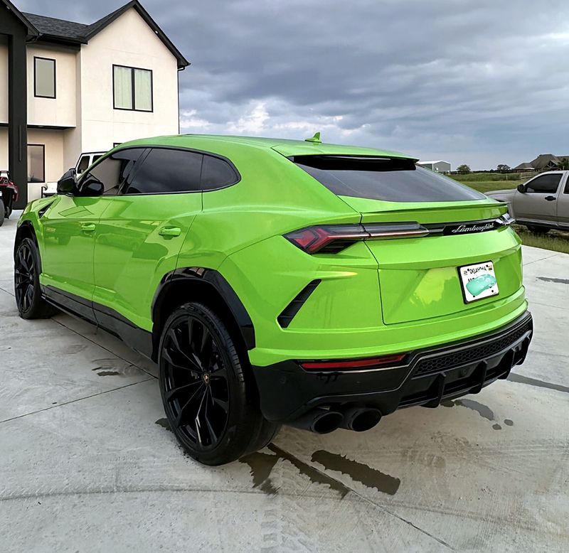 Green Lamborghini Urus, rear view
